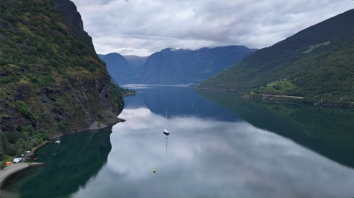 fjord of Norway with a boat in the still water